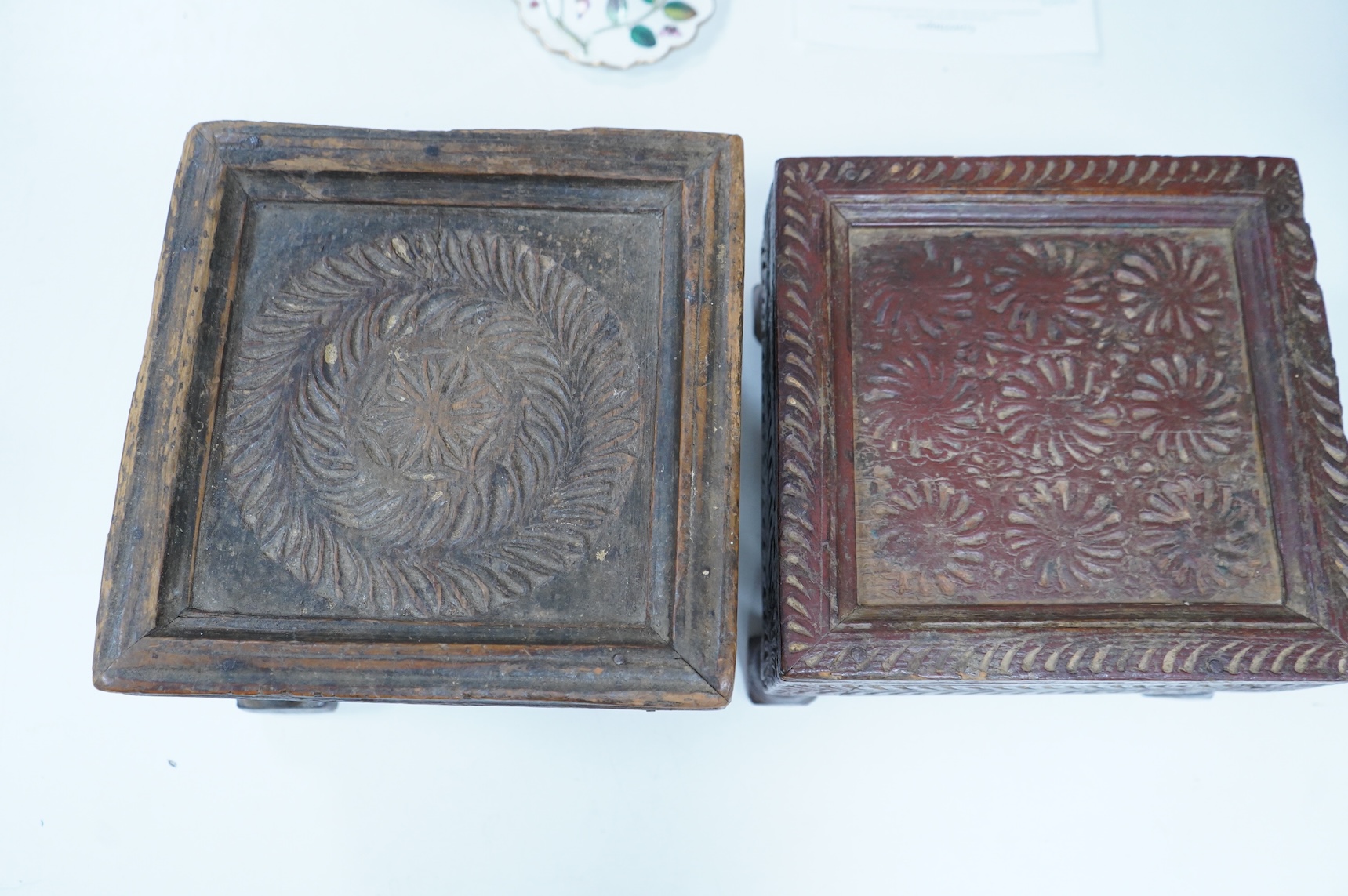 Three Indian carved wood stools or small tables, largest 27cm wide